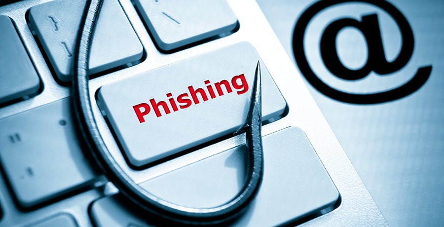 Phishing fish hook on computer keyboard with email sign_900x460