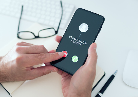 person rejecting call from unknown caller or unknown number on smartphone