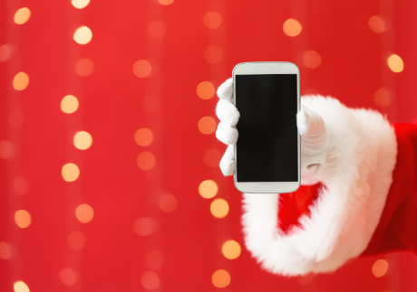 Santa holding a smartphone